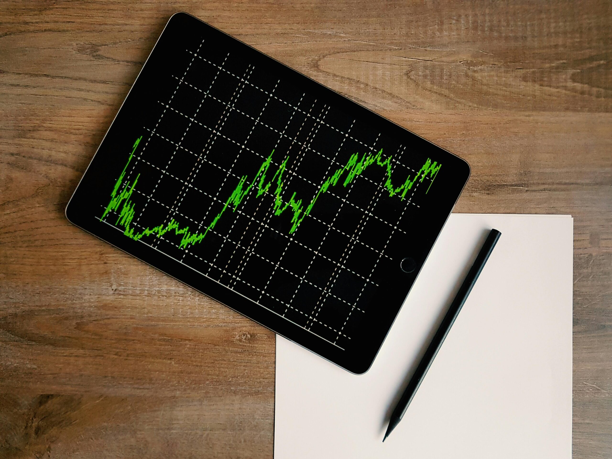 Stock market graph on a tablet, on a table