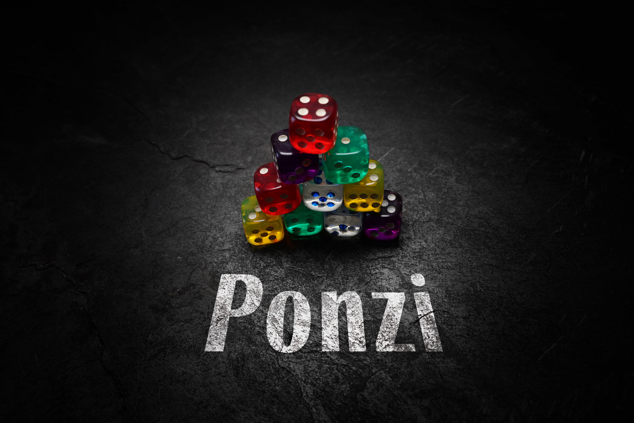Colorful dice stacked into a pyramid, next to the word "Ponzi"